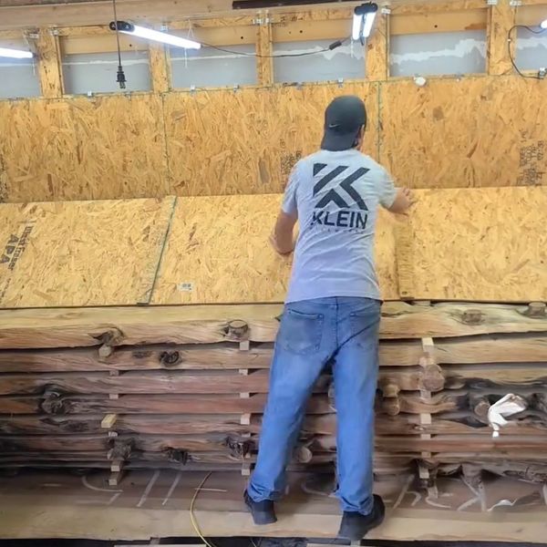 Klein Millworks workshop with lumber and woodworking equipment